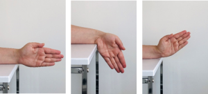 hand straight on table, rotate wrist down and up 
