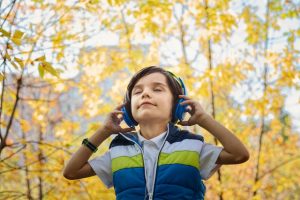 Photo of a Boy Listening in Headphones Photo by jonas mohamadi