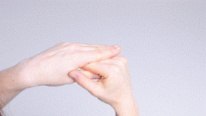 Photograph of person using one hand to bend their affected hand over at the main knuckle, keeping the fingers straight