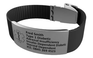 Photograph of medical bracelet with steel identification engraving and steel clasp
